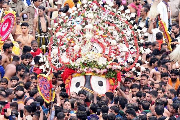 Large number of devotees gather as the Sevayats (temple servitors) perform the ‘Pahandi Vijay’ ritual - taking of the deity from the temple to the chariot in Puri. (Photo source: ANI)
