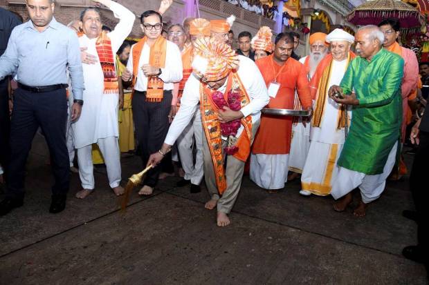 In this image, Gujarat Chief Minister Bhupendra Patel performs the traditional 'Pahind' ceremony by sweeping in front of the main chariot with a golden broom before flagging off the 148th Rath Yatra of Lord Jagannath, in Ahmedabad. (Photo source: PTI