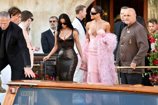 Kim Kardashian, left, and Khloe Kardashian while leaving the hotel for the wedding ceremony of Jeff Bezos and Lauren Sanchez, in Venice, Italy, Friday, June 27, 2025. (Photo source: AP)