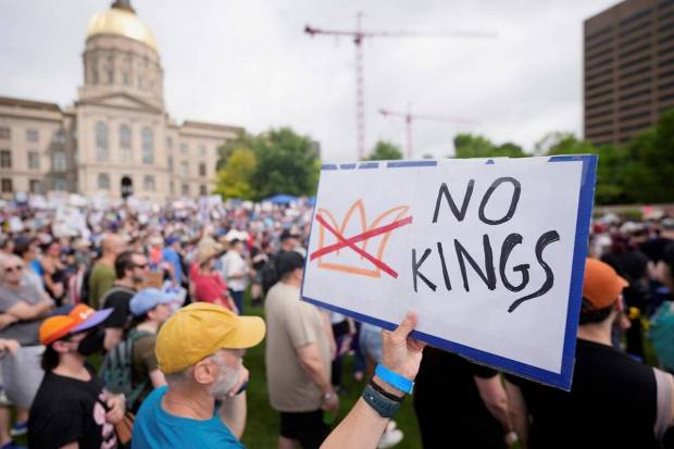 A demonstrator holds a sign during a 
