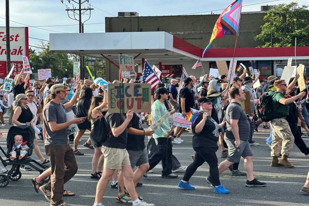 Demonstrators carry signs and chant while marching during a “No Kings” protest, Saturday, June 14, 2025, in Salt Lake City. (Photo source: AP)