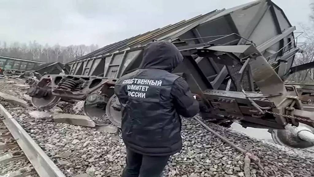 A passenger train has derailed in western Russia after a bridge collapsed, killing seven people. (Photo source: AP) A passenger train has derailed in western Russia after a bridge collapsed, killing seven people. (Photo source: AP)