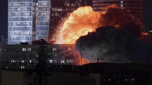 An explosion is seen during a missile attack in Tel Aviv on June 13. (AP Photo)