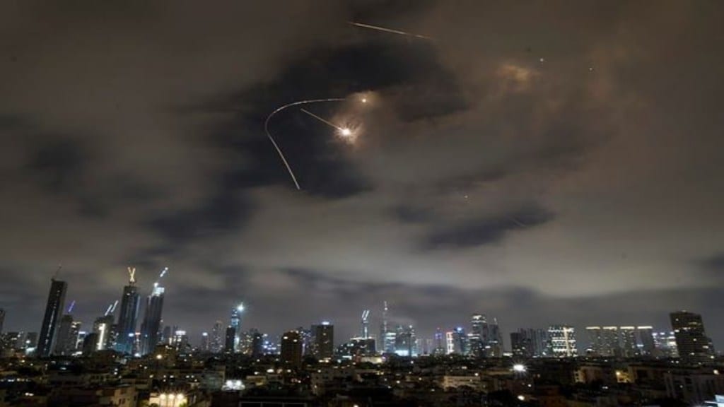 Israeli air defense system fires to intercept missiles during an Iranian attack over Tel Aviv, Israel, Saturday, June 21, 2025. (AP Photo)