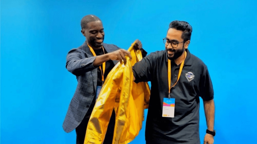 Peter Rivera (left), GM of Training and Certifications at AWS, presenting the Golden Jacket to Harshvardhan Chunawala (right) during the AWS Summit Washington, DC 2025. (Credits: LinkedIn)