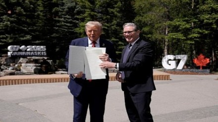 U.S. President Donald Trump, left, holds a U.K.-U.S. trade agreement with Britain's Prime Minister Keir Starmer while speaking to the media at the G7 summit in Kananaskis, Alberta, Monday, June 16, 2025. (Stefan Rousseau/Pool Photo via AP) U.S. President Donald Trump, left, holds a U.K.-U.S. trade agreement with Britain's Prime Minister Keir Starmer while speaking to the media at the G7 summit in Kananaskis, Alberta, Monday, June 16, 2025. (Stefan Rousseau/Pool Photo via AP)