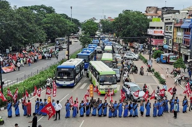 In Bhubaneswar on Wednesday, members of various trade unions blocked a road as part of the 'Bharat Bandh' (nationwide general strike) called by a forum of 10 central trade unions and their associates. (Image Source: ANI)