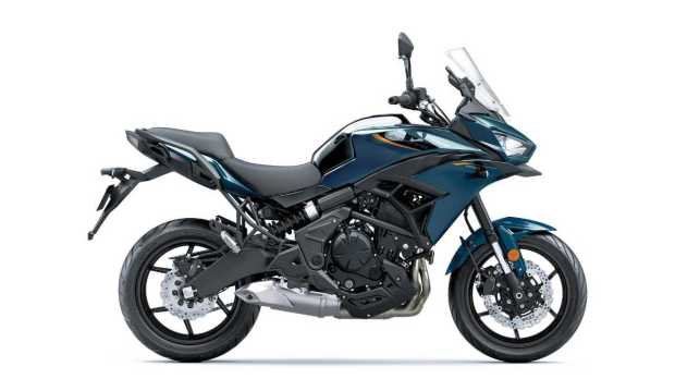 The motorcycle retains its design and functionality with a high front fairing.