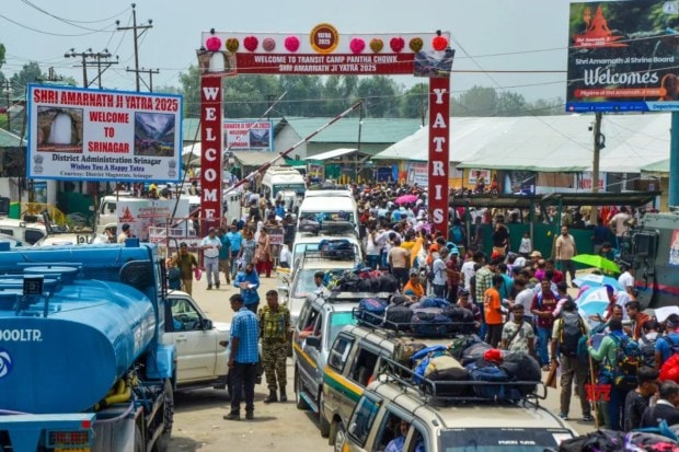 Hindu devotees arrive at the transit camp for the Amarnath Yatra Registration Center at Yatri Niwas, Pantha Chowk, in Srinagar on Wednesday, July 2. (Image Source: IANS)