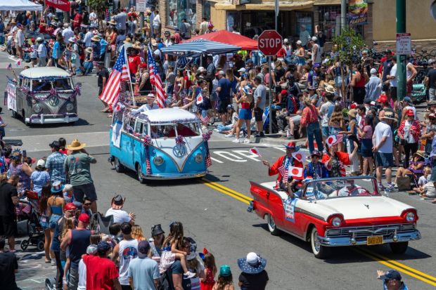 Members of the Huntington Beach Sister City Association make their way along Main Street for the iconic Fourth of July Parade. (Image: AP)