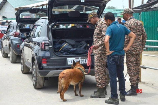 Security personnel are conducting vehicle checks with sniffer dogs outside the Amarnath Yatra Registration Centre at Pantha Chowk in Srinagar on Wednesday, July 2. (Image Source: IANS)
