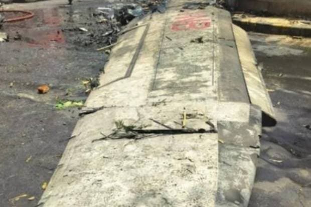 Part of the right wing was found heavily destroyed across Building A and Building B. The Outboard section of the wing was recovered over 500 feet from the first contact point. (Photo source: AAIB)