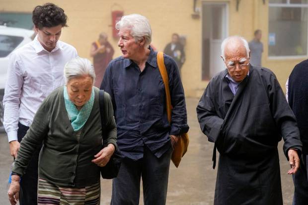 Hollywood actor Richard Gere, center, Jetsun Pema, front left, sister of Tibetan spiritual leader the Dalai Lama, and others arrive for the long life prayer ceremony. (Photo source: PTI)