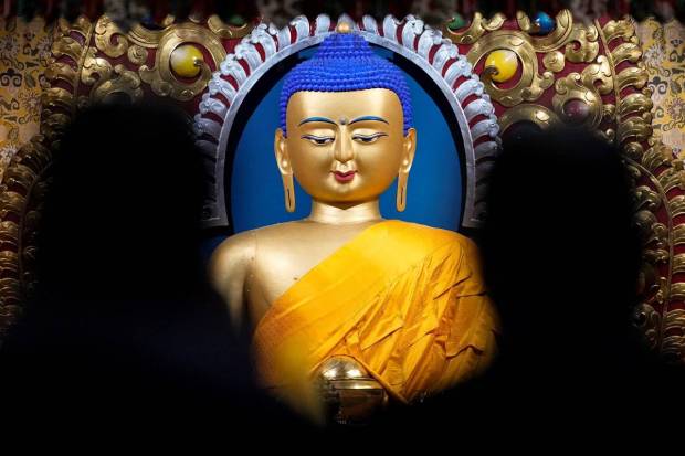 The idol of Lord Buddha at Tsuglagkhang, the main Dalai Lama temple. (Photo source: PTI)