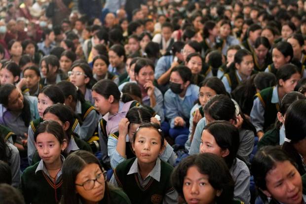 School children attending the long life prayer ceremony for the Tibetan spiritual leader, the Dalai Lama. (Photo source: PTI)
