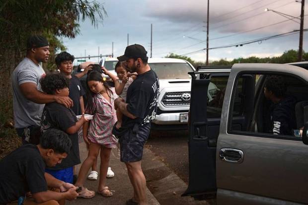 Ewa Beach residents Carlo Salas and CJ Jasper, with their families, are evacuated at the side of Kunia Road to escape the tsunami threat Kapolei, Oahu, Hawaii, Tuesday, July 29, 2025. (Photo source: AP)