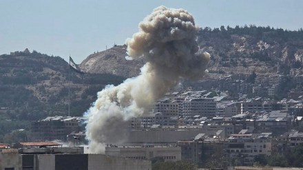 Smoke rises from an Israeli airstrike that hit the Syrian Defence Ministry (SANA via AP) Smoke rises from an Israeli airstrike that hit the Syrian Defence Ministry (SANA via AP)