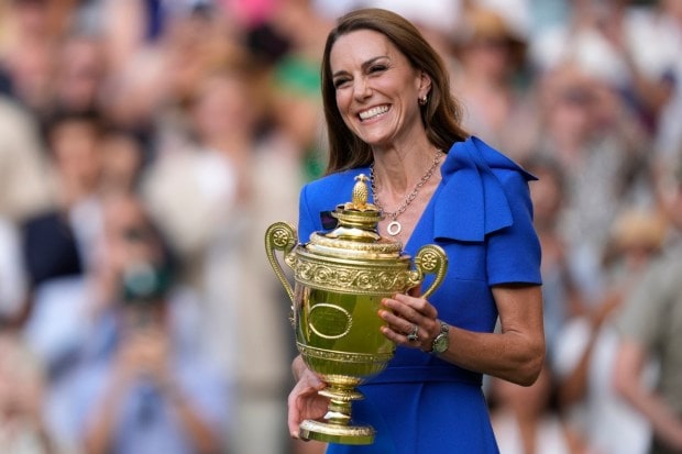 Kate, Princess of Wales, smiles while holding the trophy during the presentation ceremony after Italy’s Jannik Sinner won the men’s singles final at Wimbledon in London. (Photo: AP)
