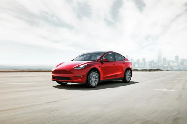 The 2025 Tesla Model Y is an electric midsize SUV with two main trims: Long Range and Performance. The Long Range version offers about 311 miles of EPA-estimated range and accelerates from 0 to 60 mph in 4.8 seconds, while the Performance trim reaches 60 mph in just 3.5 seconds but has a 277-mile range. (Image: AP)