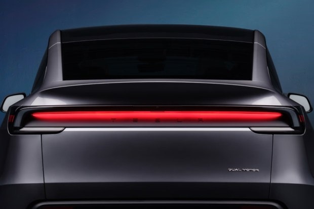 The exterior design of the 2025 Model Y includes a sleek new look with full-width LED light bars inspired by the Cybertruck. It rides on newly designed 20-inch Helix wheels and has a panoramic glass roof, giving it a futuristic, aerodynamic profile that improves efficiency and aesthetics. (Image: Tesla)