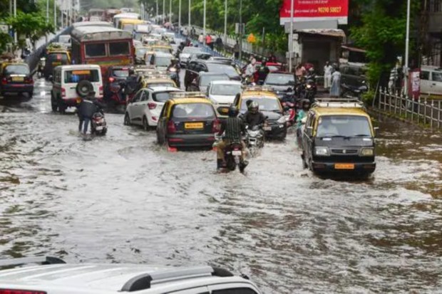 Due to heavy rain, some areas in Mumbai are flooded. This has caused trouble for commuters. The Andheri Subway in Andheri West was closed to traffic as water levels reached around 2 feet. Traffic is being redirected via Gokhale Bridge, according to Mumbai Traffic Police. (PTI Photo)