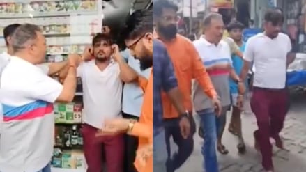 MNS workers in Mumbai forcing a shopkeeper to hold his years and apologise. MNS workers in Mumbai forcing a shopkeeper to hold his years and apologise.