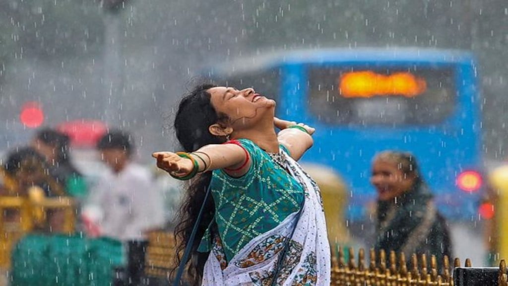 A woman enjoys rain, in Bengaluru, Karnataka, Sunday, July 20, 2025. (PTI Photo) A woman enjoys rain, in Bengaluru, Karnataka, Sunday, July 20, 2025. (PTI Photo)