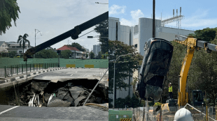 The woman was driving along Tanjong Katong Road South when a section of the road suddenly opened up, causing her and her car to fall into the sinkhole.