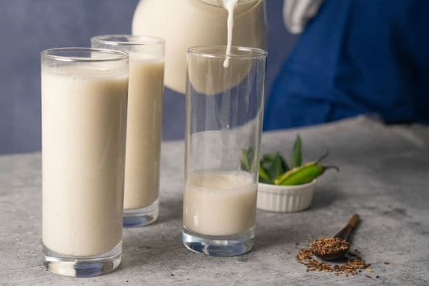 Butter Milk: A natural probiotic, buttermilk is a popular summer drink made with yogurt. Made with spices, the Onam Sadhya features a buttermilk spiced with curry leaves, cumin, oil and tempered chillis. (Image: Canva)