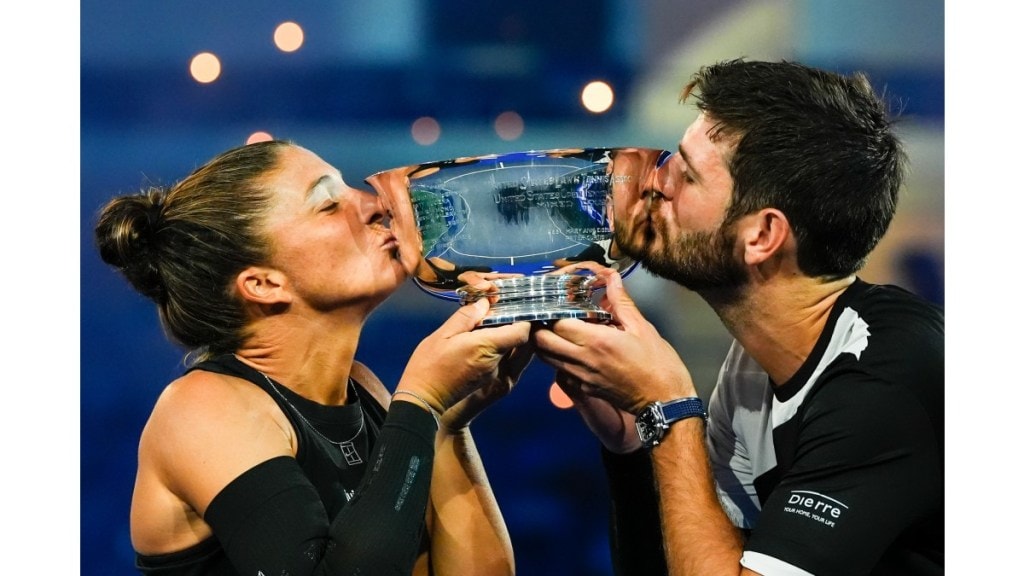 Andrea Vavassori and Sara Errani, hold up the championship trophy in the mixed doubles final at the US Open tennis championships, in New York. (Image Source: AP photo)