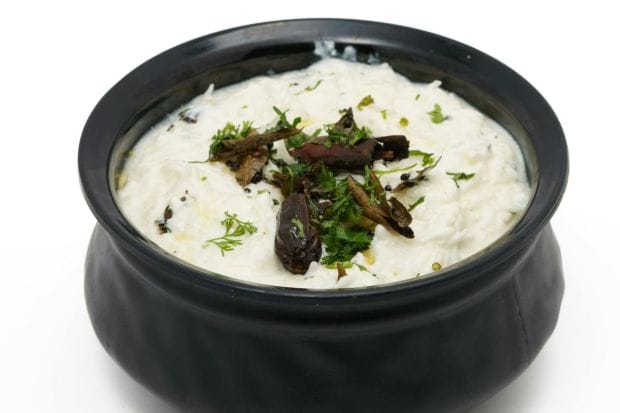 Pachadi: A sweet and tangy dish, this yoghurt-based dish features cucumber with hints of mustard and coconut. It is the perfect contrast to spicy dishes on the Onam Sadhya thali. (Image: Canva)