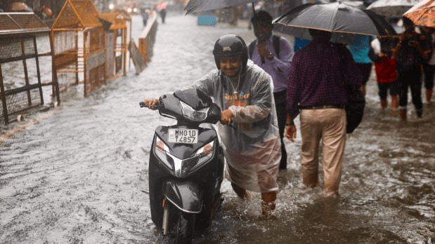 Heavy rains in Parel left its railway station, a popular spot for commuters, and the adjoining areas waterlogged. (Photo Source: Indian Express)