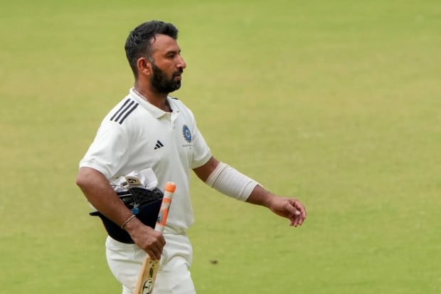 On the fourth and final day of the Duleep Trophy final between South Zone and West Zone in Bengaluru on July 15, 2023, Cheteshwar Pujara walked back to the pavilion after his second low score of the match. (Image Source: PTI)