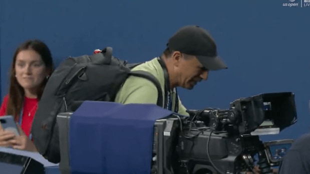 As Bonzi prepared for the second serve, cameras spotted a photographer trying to leave the court from behind and coming onto the court. (Photo Source: Screengrab from ESPN livestream)