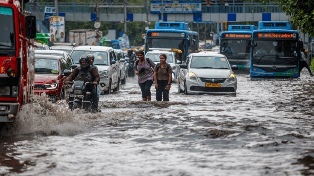 Several main roads, including Rao Tularam Marg and Moti Bagh flyover, were flooded, forcing vehicles and pedestrians to wade through deep water. Traffic congestion and delays were reported from early morning.  (Photo Source: ANI)