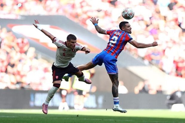 Milos Kerkez of Liverpool during match trying headshot with Daniel Munoz of Crystal Palace. (Image Source: Reuters)