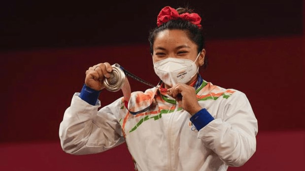 Her stellar performance at the 2020 Tokyo Olympics earned a silver medal, making her the second Indian weightlifter to win an Olympic medal and inspiring millions across India. (Photo Source: PTI)