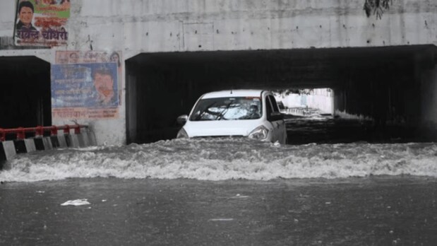 Underpasses and walkways, especially near Rafi Marg and Nizamuddin flyover, were rendered impassable, causing pedestrians to risk navigating moving traffic for safer passage. (Photo Source: ANI)