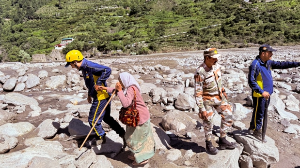 In this image released by @uttarakhandcops via X on Aug. 7, 2025, A stranded person is being rescued from a disaster-affected area of Uttarkashi, in Uttarakhand.  (Photo Source: @uttarakhandcops on X via PTI