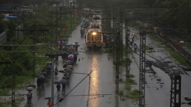 Train stopped running between Kurla and Tilaknagar Station on the Harbour line due to waterlogging on the tracks as the Mithi river reached danger level. (Photo Source: Indian Express)