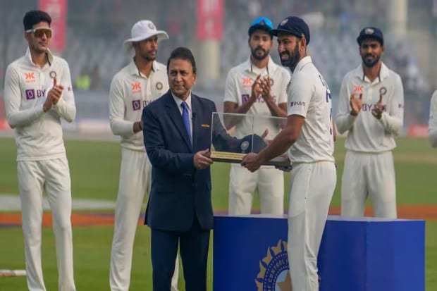 Former Indian captain and legendary cricketer Sunil Gavaskar, who has been a vocal admirer of Cheteshwar Pujara's contributions, presented him with a special cap to commemorate his 100th Test match. (Image Source: AP)