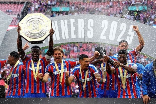 Marc Guehi of Crystal Palace lifts the trophy and celebrates with his teammates after winning the FA Community Shield. (Image Source: Reuters)