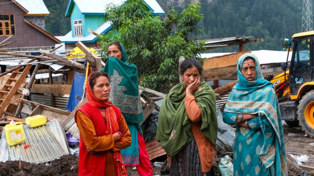 Women gather during a search and rescue operation at Chisoti village after a flash flood triggered by a cloudburst, in Kishtwar, Saturday, Aug. 16, 2025 (Photo Source: PTI)