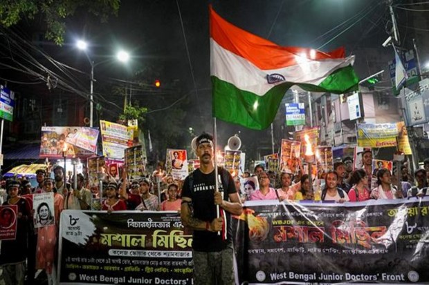 Doctors and members of the Junior Doctors' Forum held a torch rally from College Street to Shyambazar in Kolkata, raising slogans on the eve of the one-year anniversary of the rape and murder of a trainee doctor at RG Kar Medical College and Hospital. (Image Source: PTI)