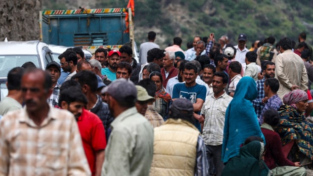 People at the disaster-hit Chisoti village in India gather on streets accounting their loss in the aftermath of the flash flood triggered by a cloudburst, in Kishtwar district, Jammu and Kashmir on Friday. Photo Source: PTI)  