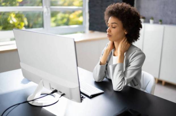 Adjust the workstation posture: To prevent long-term back and neck issues, fix your chair and desk at a correct height and distance from the screen. (Photo source: Canva)