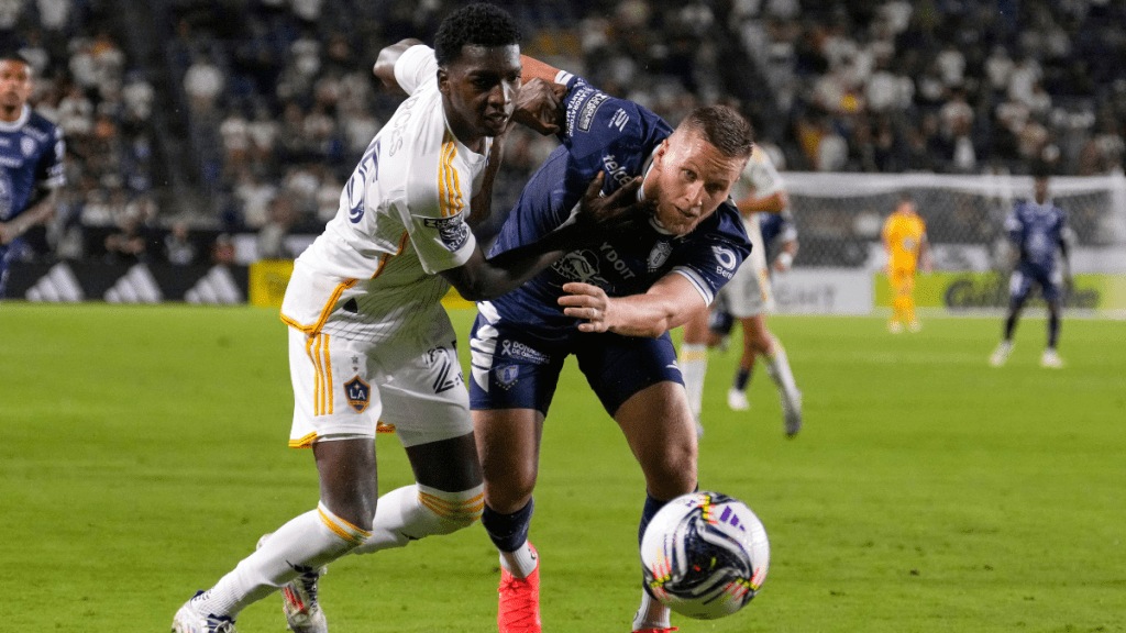 LA Galaxy defender Carlos Garcés, left, and Pachuca forward Alexandre Zurawski go after the ball during the second half of a Leagues Cup quarterfinal soccer match.