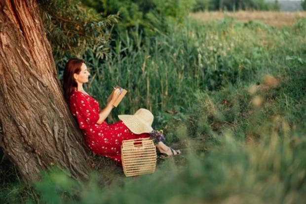 Give preference to self-care: Small activities like reading, indulging in hobbies, and stretching can help recharge yourself. (Photo source: Canva)