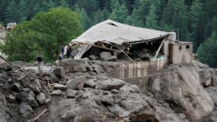 A building damaged by the flash floods is seen in Chositi village (Photo: AP)