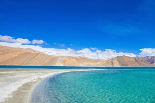 Leh, Ladakh: Located in a rain-shadow, Leh usually remains dry during monsoon, and offers clear views, lesser crowds, and high-altitude greenery. (Photo source: Canva)
